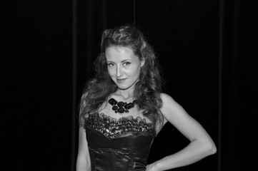 Monochrome picture of elegant brunette retro woman wearing jewelry of black diamond