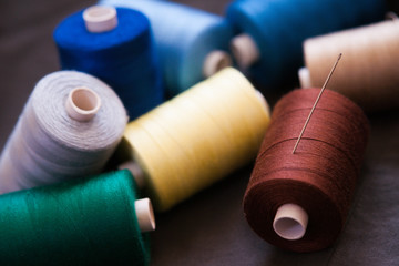 Pile of colorful spools of thread 