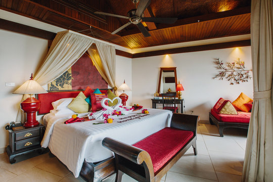 Luxury hotel bedroom interior with honeymoon decoration