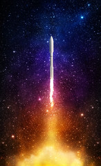 Flying space rocket in the night starry sky. Space exploration background. Elements of this image...