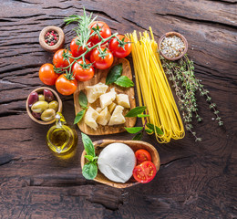 Variety of popular italian food on the wooden table. Top view.