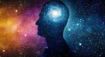 The universe within. Silhouette of a man inside the universe. The concept on scientific and philosophical topics.  Elements of this image furnished by NASA.