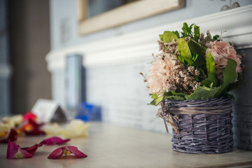 Beautiful hyacinth flowers in a basket on a textural background.
