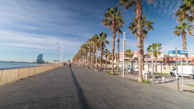 pov shot travelling around the beach  in Barcelona in the early morning on an electric skateboard
