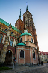 The Cathedral of St. John the Baptist in Wrocław, lamplighter man lighting the lamps