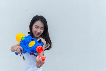 Fototapeta premium Asian sexy woman with water in hand on white background,Festival songkran day at thailand,The best of festival of thai,Land of smile