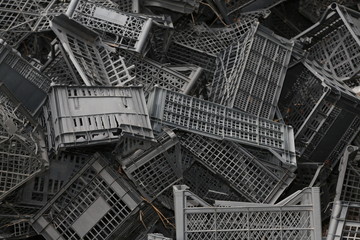 Fototapeta premium Piled black crates for scrap