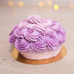 birthday concept - purple cupcake on wooden table