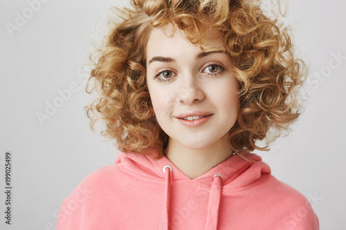 Close Up Portrait Of Trendy Attractive Curly Haired Woman With