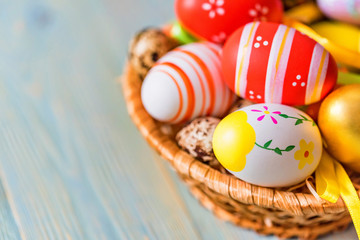 Fototapeta na wymiar Several colorful Easter eggs in basket close