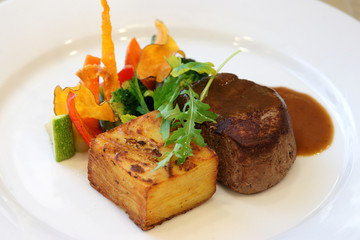 meat with spices on white plate. gourmet food
