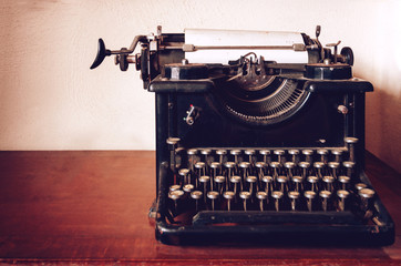 vintage looking photo of an old typewriter on a table