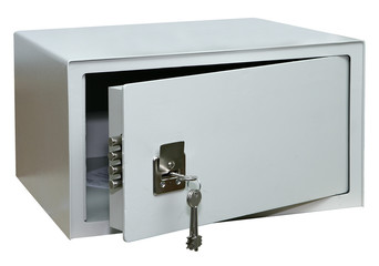 Opened metal safe with keys in the keyhole, isolated