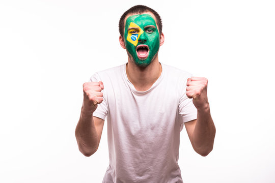 Happy victory scream fan support Brazil national team with painted face isolated on white background