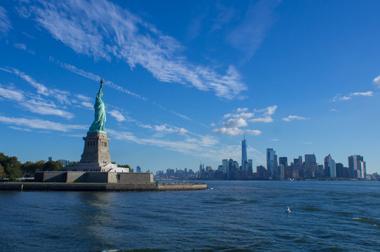 The Statue of Liberty in front of the New York skyline