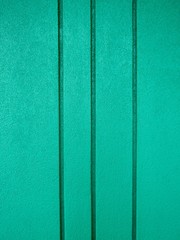 Fototapeta premium Turquoise blue grooved concrete wall background texture