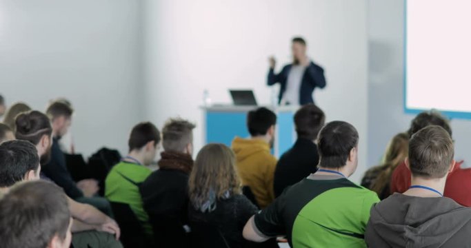 Listening to the speech about marketing and management of the trading company for successful sales. Talk about politics and finance. Economic and political problems of our time. Learn to sell indoors