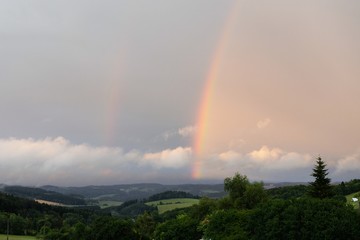 Two rainbows in the sky in landscape