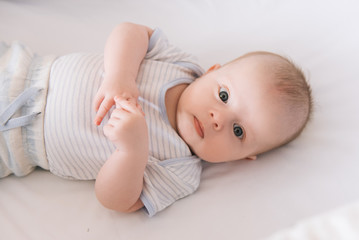 Beautiful newborn baby lying in the crib