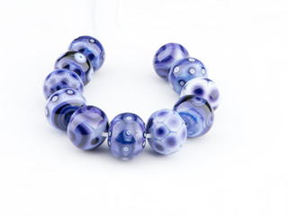 Lampwork glass beads made by let fire inspire