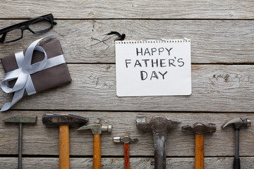 Happy Fathers Day card on rustic wood background