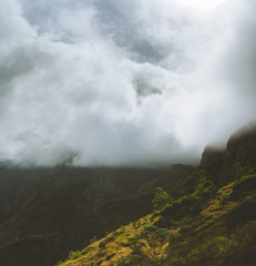 Cape Verde. Stunning scenery with cloudy mist flowing over huge mountain edge and slopes and spilling into the green valley. Santo Antao Cape Verde Cabo Verde