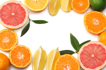 healthy food. mix sliced lemon, green lime, orange, mandarin and grapefruit with green leaf isolated on white background. top view with copy space