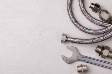 Plumbing tools for connecting water taps with space for text, top view