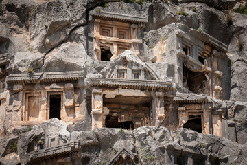 Naklejka premium Ancient lycian necropolis with tomb carved in rocks in Mira,