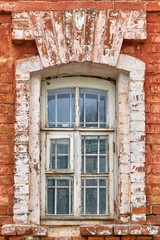 White window and Detail of house exterior on red wall.