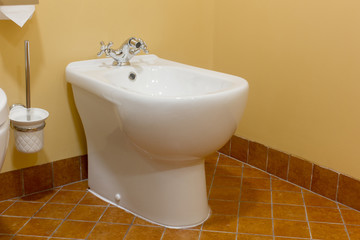 White ceramic bidet in modern bathroom. - obrazy, fototapety, plakaty
