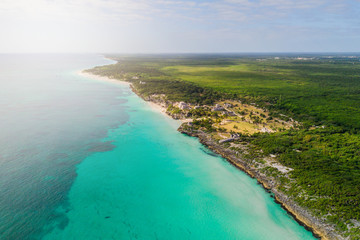 Ruins of Tulum, Mexico overlooking the Caribbean Sea in the Riviera Maya Aerial View. Tulum beach Quintana Roo Mexico - drone shot. White sand beach and ruins of Tulum.