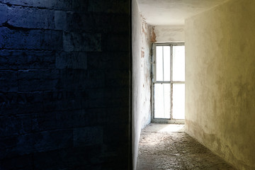 Bright window in the dungeon or in the bunker. Image divided into two halves