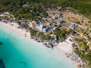 Ruins of Tulum, Mexico overlooking the Caribbean Sea in the Riviera Maya Aerial View. Tulum beach Quintana Roo Mexico - drone shot. White sand beach and ruins of Tulum.