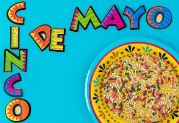 Cinco De Mao bright background with colorful mexican butter cookie with sprinkles.