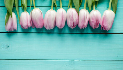 tulips bouquet on  wooden background