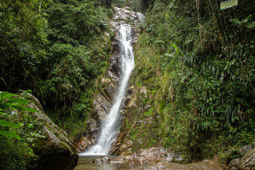 Fototapeta na wymiar A waterfall in the tropical forest, near Medellin, Antioquia, Colombia