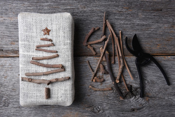 Burlap Present with Twig Christmas Tree and Shears