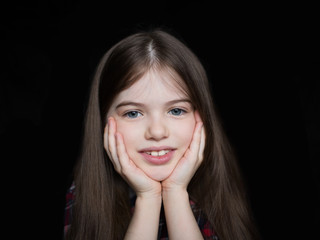portrait of a little beautiful cute girl on  black background
