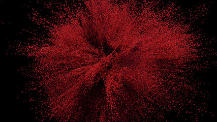 Red Sand explosion on black background