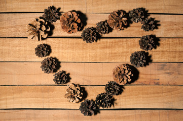 a bunch of cones on a wooden Board