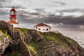 Fototapeta na wymiar Lighthouse in a mountain top in Sagres, Portugal