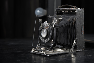 retro photo camera on a dark table