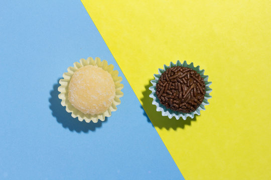 Brazilian sweets: Beijinho and Brigadeiro. Children birthday parties. Flat design of candy ball on color background.