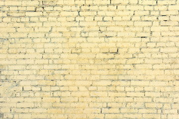 Yellow brick wall from the unseen rows. Blank background. Texture of masonry.