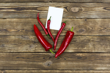 Red pepper. Pepper on a wooden background.