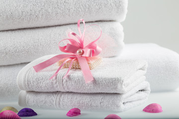Obraz na płótnie Canvas Towel concept. Spa concept. Photo for hotels and massage parlors. Purity and softness. Towel textile. 