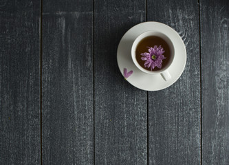 Horizontally background with flower in the cup and space