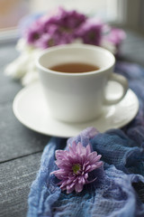 Vertically background with flower on the blue gauze and cup