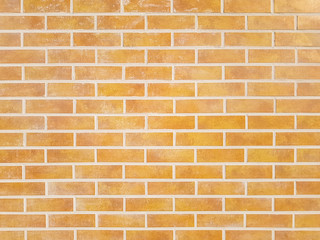 Close-up of yellow brick wall texture pattern for background and wallpaper. High-quality macro photography.